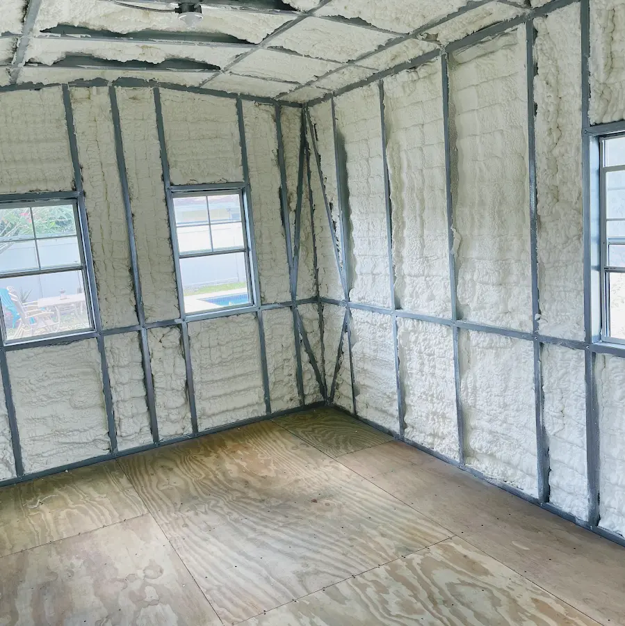 Closed-cell spray foam insulation applied to wall cavities in a residential project in Norton
